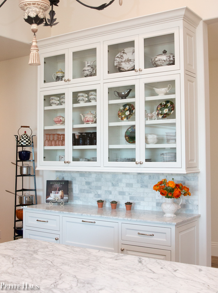 Butler's Pantry with white cabinets and marble counters