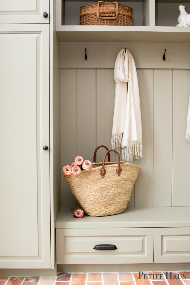 Farmhouse mudroom with brick floors