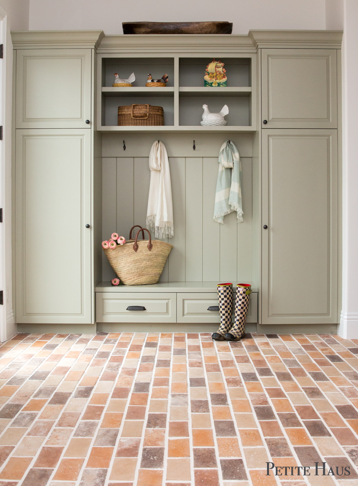 Farmhouse Mudroom with brick floors and hen on nests