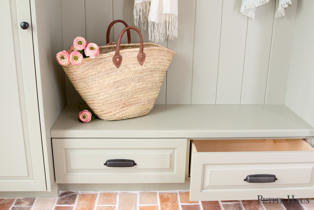 Farmhouse mudroom with brick floors