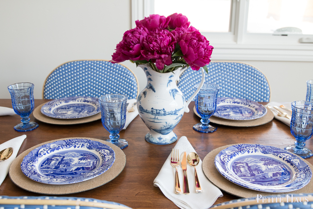 blue and white table setting with French bistro chairs and peonies