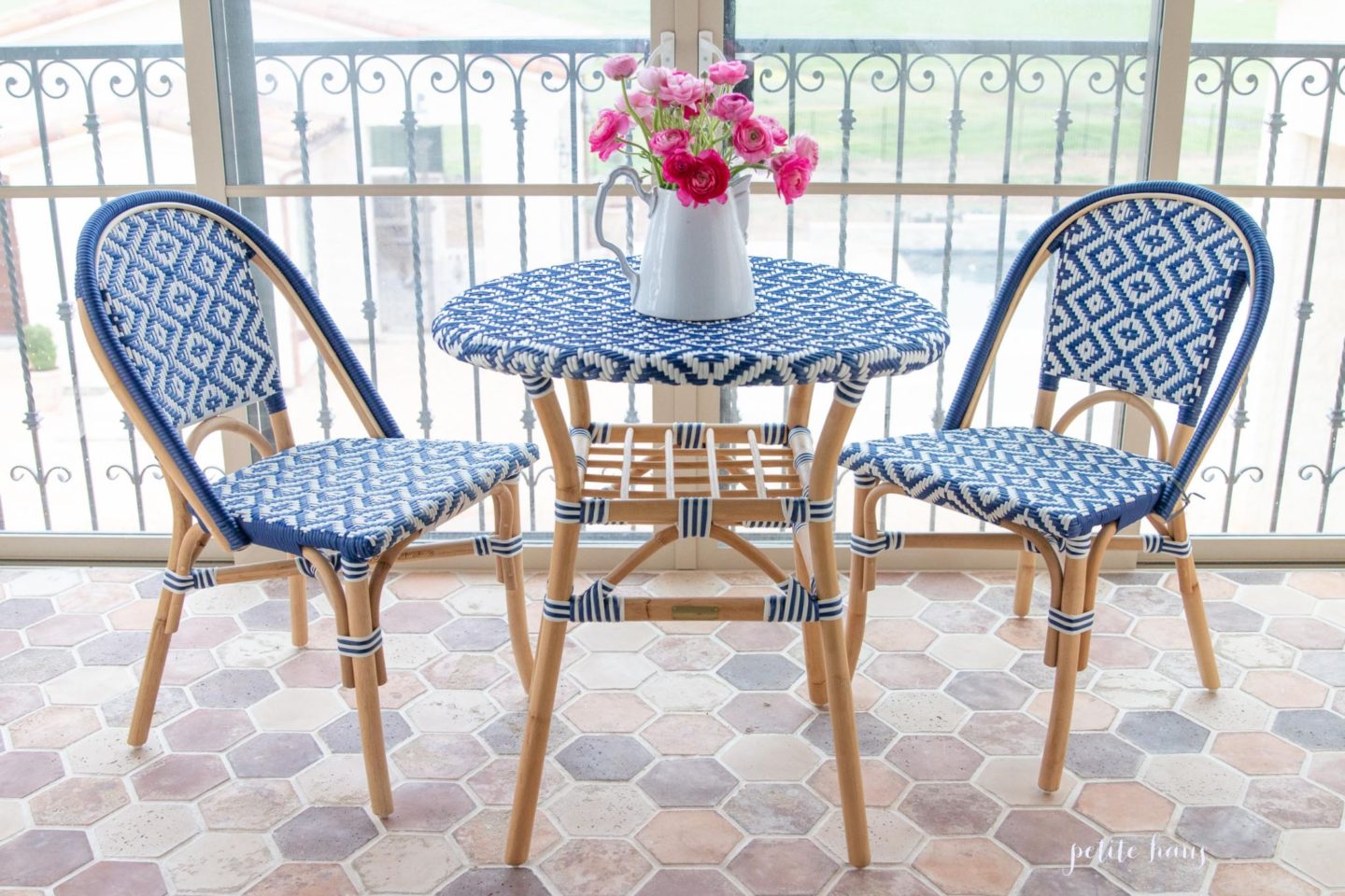 blue and white French bistro chairs on the porch