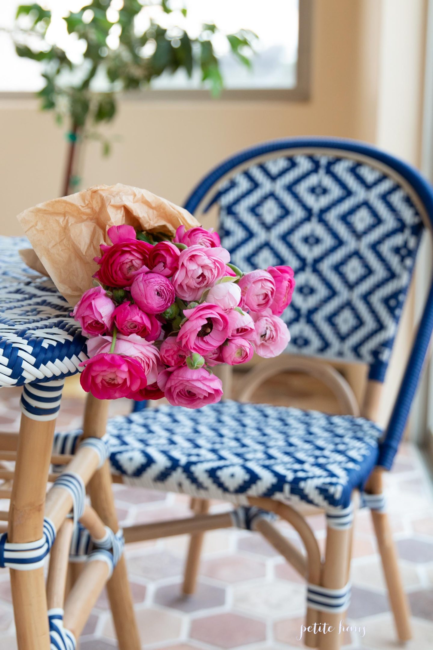 blue and white French bistro chairs on the porch