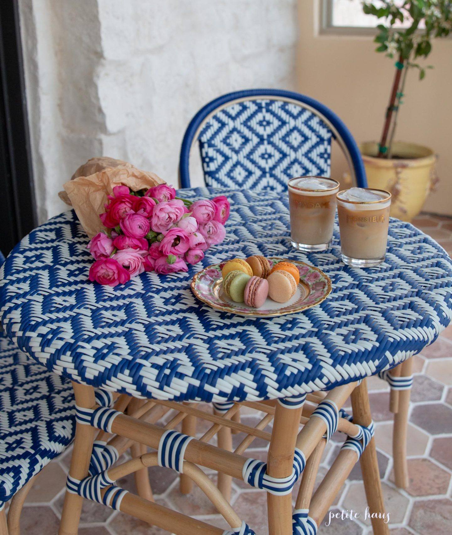 blue and white French bistro chairs on the porch